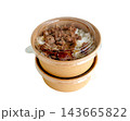 Two stacked kraft paper bowls with clear plastic lids containing grilled meat over white rice. Sustainable food packaging for takeaway or delivery isolated on a white background. 143665822