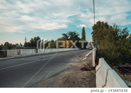 Rural Road with White Bridge Railings Rural Road with White Bridge Railings 143665836