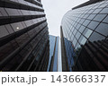 Upward perspective of corporate glass skyscrapers and office buildings in financial district 143666337