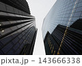 Low angle view of modern glass office skyscrapers 143666338