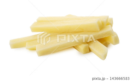 Cut raw potatoes into long strips for making French fries isolated on a white background 143666583
