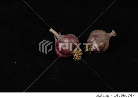 Two onions arranged on a black background for cooking Two onions arranged on a black background for cooking 143666747