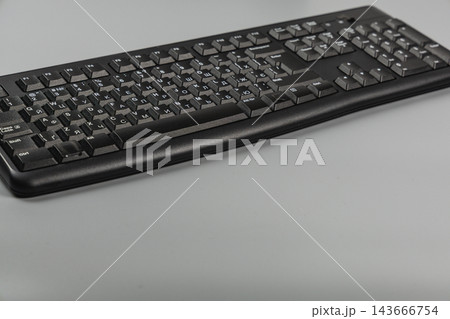 Keyboard on a desk in an office for typing and computer work Keyboard on a desk in an office for typing and computer work 143666754