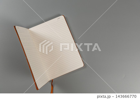 Notebook on a gray surface ready for writing and planning 143666770