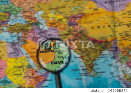 Exploring the map with a magnifying glass to find destinations 143666872