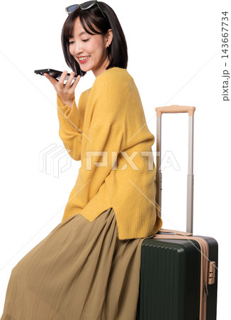 Happy young asian woman sitting on luggage sending audio voice message using smartphone with artificial intelligence technology assistant app isolated on transparency background Happy young asian woman sitting on luggage sending audio voice message using smartphone with artificial intelligence technology assistant app isolated on transparency background 143667734