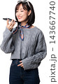 Happy smiling asian woman speaking voice message on smartphone using modern artificial intelligence technology application with joy on isolated transparency background cutout 143667740