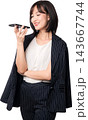 Happy young Asian woman using smartphone voice assistant artificial intelligence features with joyful emotion, isolated on transparent transparency background 143667744