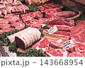 Raw beef steaks and roasts in a butcher counter at a food market, London, UK 143668954
