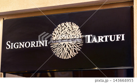 Cefalu, Italy. 21 August 2026. Urban landscape. Neon sign with the inscription: Signorini Tartufi. Cefalu, Italy. 21 August 2026. Urban landscape. Neon sign with the inscription: Signorini Tartufi. 143668955