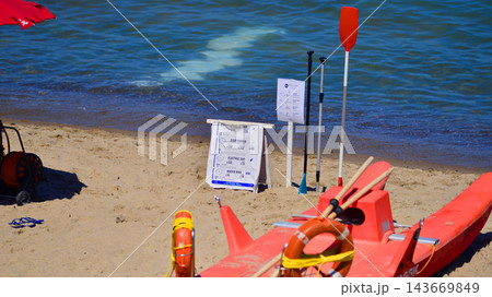 Cefalu, Italy. 20 August 2026. A seaside beach in summer. Signs listing hourly rental prices for water sports equipment. 143669849