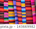 Colorful mexican serapes displaying traditional woven striped fabric 143669982
