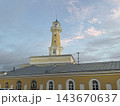 Historic yellow mosque with ornate minaret beneath pastel evening sky and crossing utility wires Historic yellow mosque with ornate minaret beneath pastel evening sky and crossing utility wires 143670637