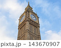 Big Ben clock tower against a blue sky with clouds in London, UK 143670907