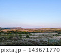 Open grassy hills and rolling countryside beneath a vast blue sky 143671770