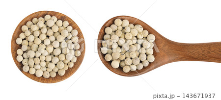 White peppercorns or pepper in wooden bowl and spoon isolated on white background. Top view. Flat lay White peppercorns or pepper in wooden bowl and spoon isolated on white background. Top view. Flat lay 143671937