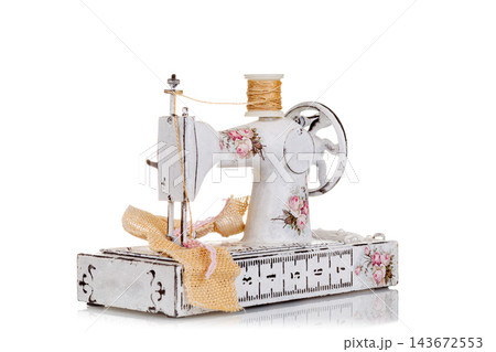 decorative sewing machine on a white background 143672553