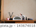Nail care tools and items ready for use in a beauty salon setting during the day 143674018