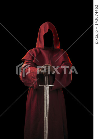 Ghostly figure in red hood with medieval sword isolated on black Ghostly figure in red hood with medieval sword isolated on black 143674462