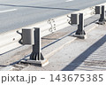 Closeup view of a metal guardrail and support posts 143675385