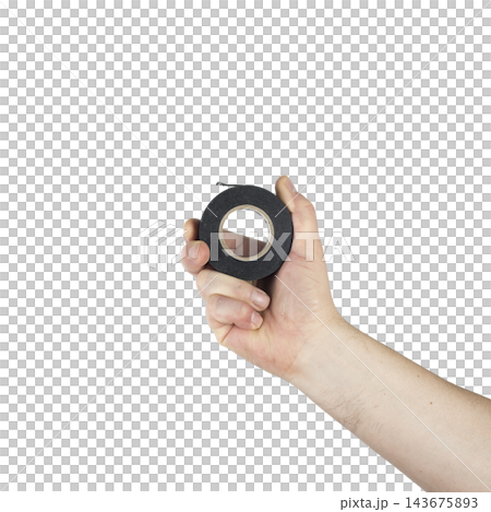 A hand holds a roll of black electrical tape A hand holds a roll of black electrical tape 143675893