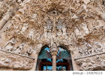 Sculpted Nativity facade doorway of Sagrada Familia with stone figures and teal ceramic foliage Sculpted Nativity facade doorway of Sagrada Familia with stone figures and teal ceramic foliage 143676113