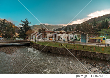 Freser riverbank with Ribes de Fresser lettering and village square in Catalan Pyrenees 143676182