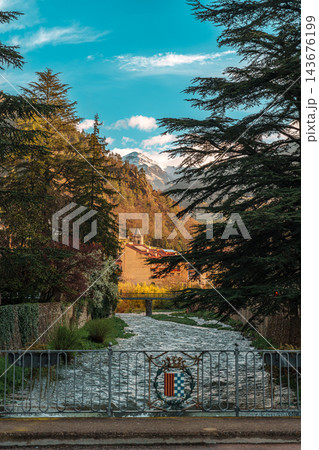 Stone bridge over Freser river with giant cedar and snowy Pyrenees peak in Ribes de Fresser Stone bridge over Freser river with giant cedar and snowy Pyrenees peak in Ribes de Fresser 143676199