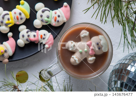 Christmas marshmallows. Winter candy. Sweet food in december. Snowman and Santa Claus. 143676477