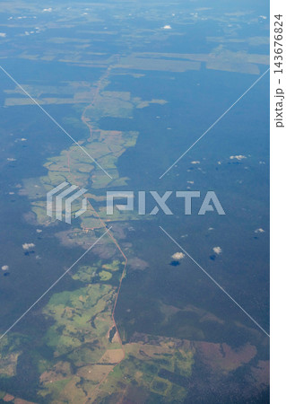 Aerial view of a partially deforested forest with clearings in woods. Amazon rainforest, Brazil Aerial view of a partially deforested forest with clearings in woods. Amazon rainforest, Brazil 143676824
