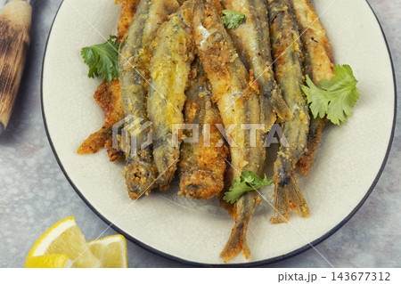 Golden Fried Capelin with Fresh Herbs Golden Fried Capelin with Fresh Herbs 143677312