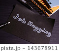 Job hugging message on paper highlights the desire for employment stability. 143678911