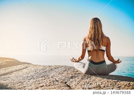 Beach, back and woman with meditation for yoga, wellness and spiritual peace in California. Zen, female yogi and hands with lotus pose for chakra, relax and mental health by mockup space outdoor 143679388