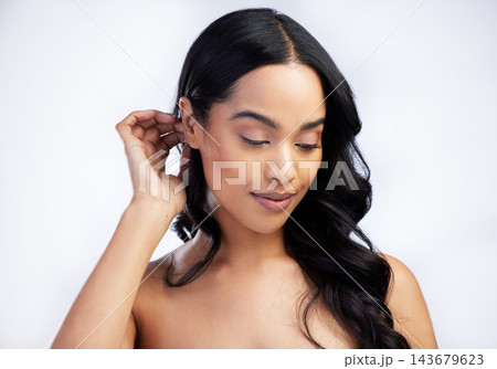 Hair care, beauty and woman with curly style in studio for salon aesthetic and healthy scalp for growth. Model girl, keratin texture and confidence with shampoo for shine results by white background Hair care, beauty and woman with curly style in studio for salon aesthetic and healthy scalp for growth. Model girl, keratin texture and confidence with shampoo for shine results by white background 143679623