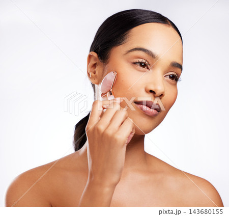 Detox, woman and rose quartz as face roller for beauty, anti aging or dermatology on white background. Female person, cosmetic product and skincare for results in studio backdrop for wellness or glow 143680155