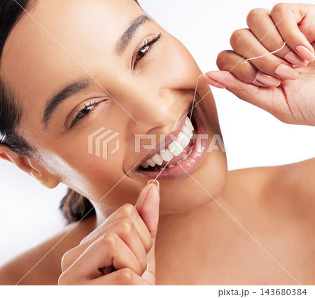 Studio, floss and woman in portrait for dental, healthcare and food particles. female model, plaque removal and teeth product for wellness, oral hygiene and prevention of cavities by white background Studio, floss and woman in portrait for dental, healthcare and food particles. female model, plaque removal and teeth product for wellness, oral hygiene and prevention of cavities by white background 143680384