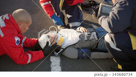 Paramedic, oxygen and outdoor with patient, healthcare and rescue of breathing, service or ambulance for person. EKG monitor, accident or injury on street, pulse oximeter and EMS with victim in USA Paramedic, oxygen and outdoor with patient, healthcare and rescue of breathing, service or ambulance for person. EKG monitor, accident or injury on street, pulse oximeter and EMS with victim in USA 143680734