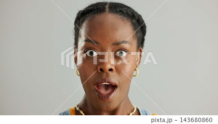 Portrait, surprised and black woman in studio with omg for announcement, gossip or fake news on gray background. Open mouth, emoji and person with reaction for secret, wtf or unexpected revelation Portrait, surprised and black woman in studio with omg for announcement, gossip or fake news on gray background. Open mouth, emoji and person with reaction for secret, wtf or unexpected revelation 143680860