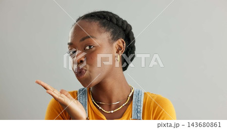 Black woman, portrait and hand kiss in studio for flirting love, romance and care emoji with support of aesthetic date. African, female person and air lips for kindness, pride and white background Black woman, portrait and hand kiss in studio for flirting love, romance and care emoji with support of aesthetic date. African, female person and air lips for kindness, pride and white background 143680861