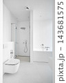 Modern empty clean white bathroom interior mockup with bathtub, glass shower cabin, and toilet. 143681575