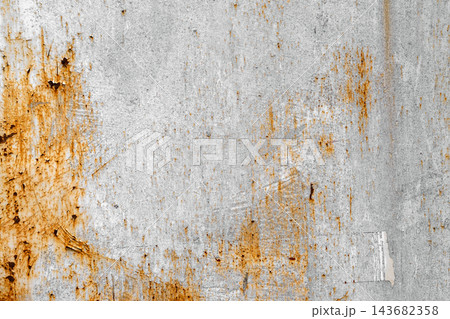 Rusty metal surface texture, peeling grey and orange paint. Flat lay macro photograph of heavily corroded metal plate, flaking light grey paint, bright orange rust stains, grungy industrial background Rusty metal surface texture, peeling grey and orange paint. Flat lay macro photograph of heavily corroded metal plate, flaking light grey paint, bright orange rust stains, grungy industrial background 143682358