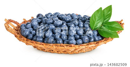 blueberry in wicker basket isolated on white background blueberry in wicker basket isolated on white background 143682509