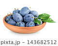 fresh blue plum in wooden bowl isolated on white background 143682512