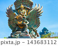 Landscape picture of old Garuda Wisnu Kencana GWK statues as  Bali landmark with blue sky as a background. Balinese traditional symbol of hindu religion. Popular travel destinations in Indonesia. 143683112