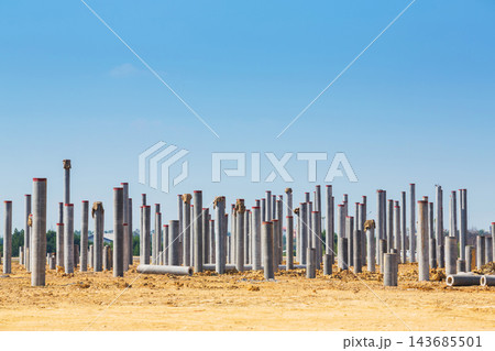 Concrete Pile Foundation at Construction Site Under Blue Sky 143685501