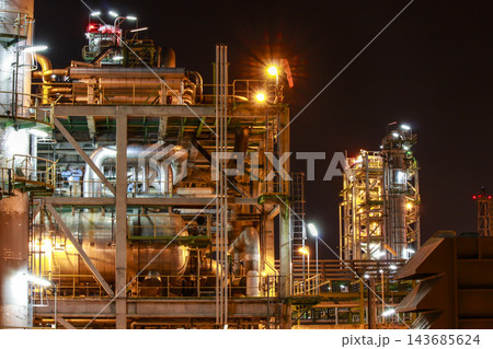 Illuminated Oil Refinery and Petrochemical Plant at Night Illuminated Oil Refinery and Petrochemical Plant at Night 143685624