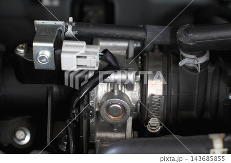 Car Engine Throttle Body and Air Intake Hose Close-Up 143685855