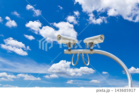 Security Surveillance Cameras Against Blue Sky Security Surveillance Cameras Against Blue Sky 143685917