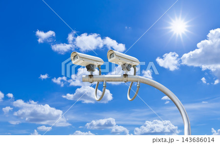 CCTV Security Cameras Against Bright Blue Sky 143686014
