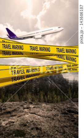 An airplane flying through a cloudy sky behind yellow caution tape that reads TRAVEL WARNING, symbolizing flight cancellations and travel restrictions. Concept of travel restrictions 143686187